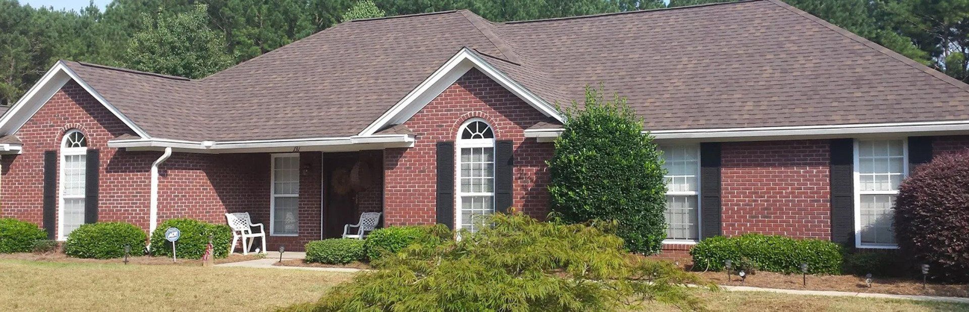 Aerial view of a recently completed residential roofing project by Life Style Roofing in Georgia
